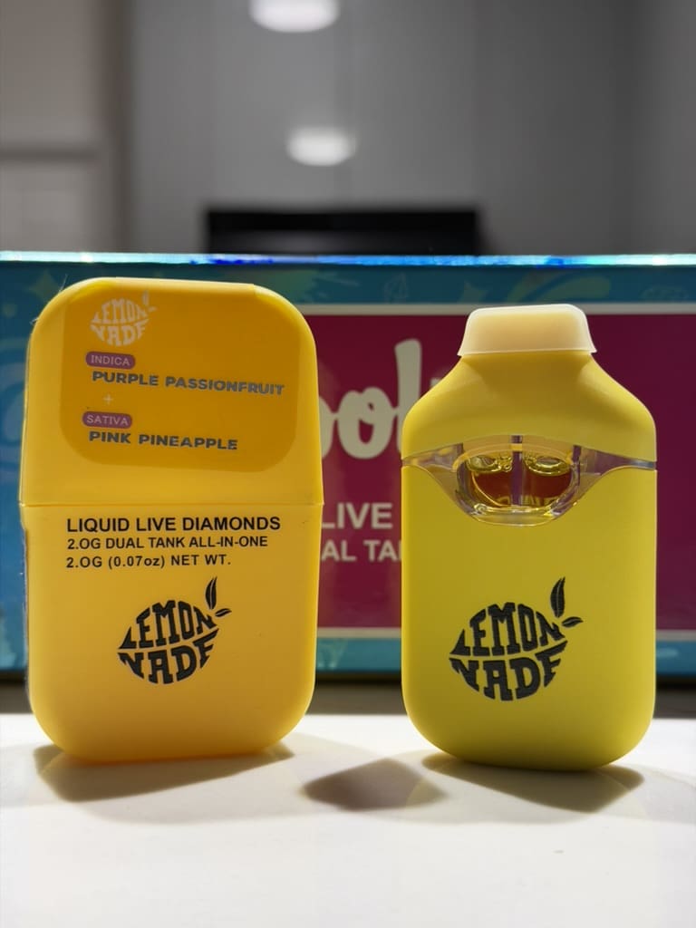 27890F27-F726-49DF-B74B-AA1E24DC5F4A_1_105_c.jpeg Lemonade Dual Tank Disposable Vape – Purple Passionfruit x Pink Pineapple | Indica x Sativa - Image 1